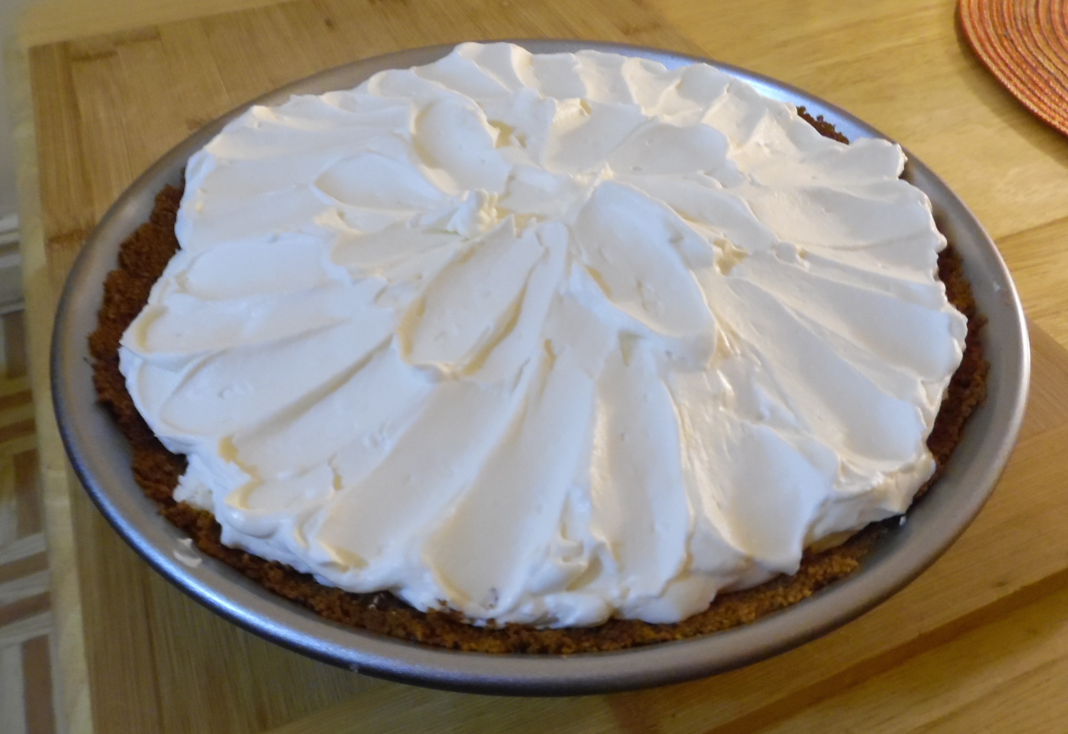 Topping spread over filled and cooled pie.
